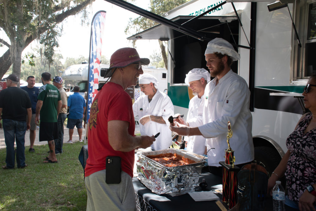 Flagler County Fire Chief tasting the competition's chili