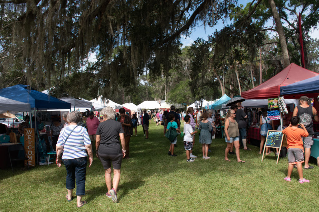 guests walking the paths through the vendor booths