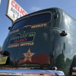 A vintage green sheriff's vehicle with 
