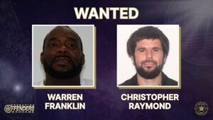 Two men, labeled Warren Franklin and Christopher Raymond, are shown in passport style photos on a “WANTED” notice with police and operation logos in the corners
